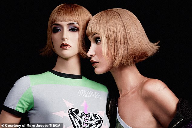 Lookalike: Both Bella and the mannequin have short, caramel-colored wigs