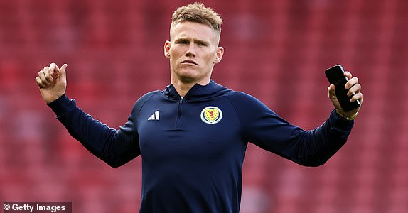 GLASGOW, SCOTLAND - SEPTEMBER 12: Scotland's Scott McTominay reacts as he inspects the pitch ahead of the 150th Anniversary Heritage Match between Scotland and England at Hampden Park on September 12, 2023 in Glasgow, Scotland.  (Photo by Ian MacNicol/Getty Images)