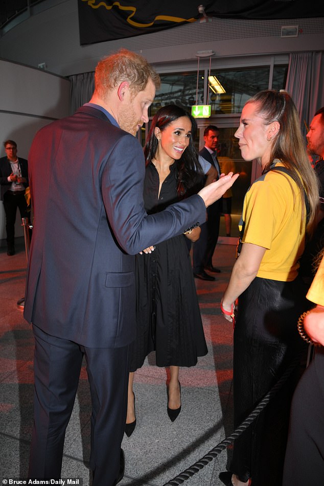 Meghan and Harry pictured tonight during the Invictus Games