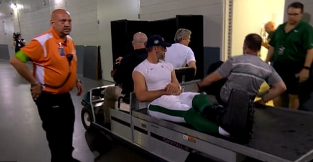 As he was led off the field, Rodgers was seen wearing a protective boot