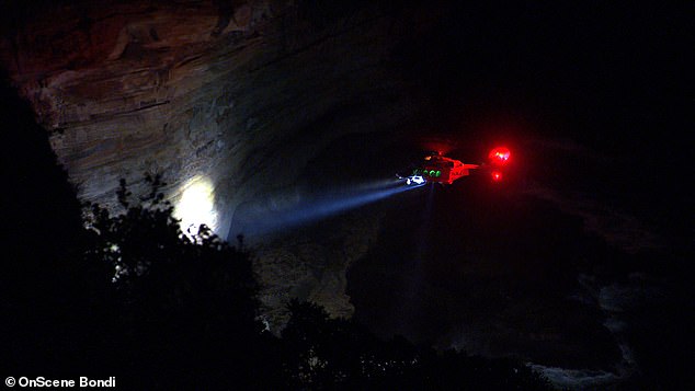 Police and paramedics arrived at Raleigh Reserve after being contacted by locals, who found his car on fire at the bottom of a 70-metre cliff (pictured)