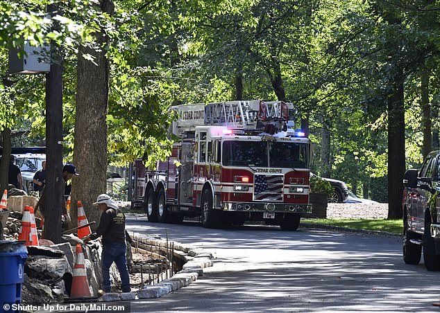 Hours later, police and firefighter were seen in photos exclusive to DailyMail.com