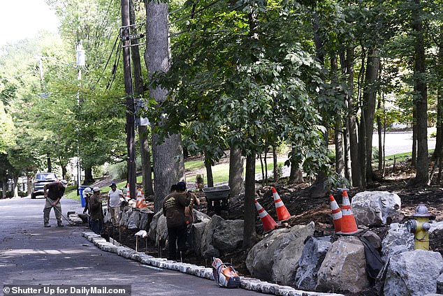 The workers built a stone wall along the outer edge of the property