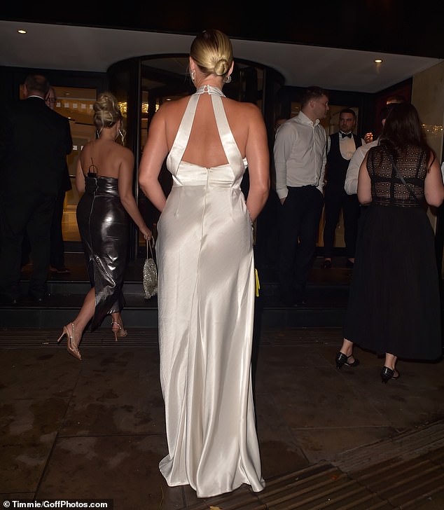 Bombshell: Billie wore her blonde locks in a chic updo as she entered the lavish venue