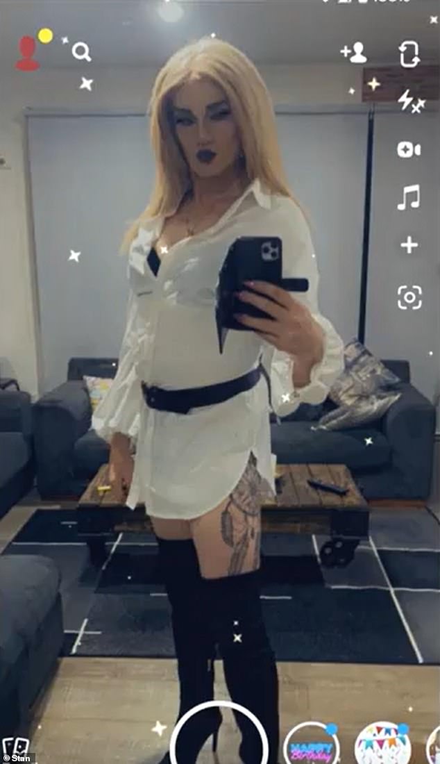 In never-before-seen images, the ex-North Melbourne coach is dressed in a white T-shirt dress and black thigh-high boots, showing off her dreamcatcher thigh tattoo.