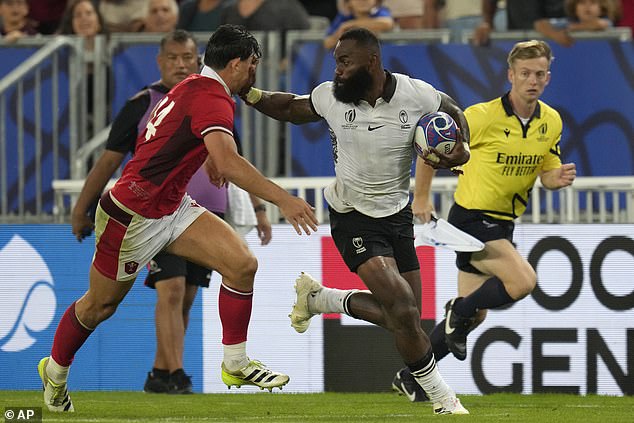 A sideline official watches Fijian star Semi Radradra make a break against Wales and checks to make sure he doesn't get into touch.  Just don't ask him to check the time