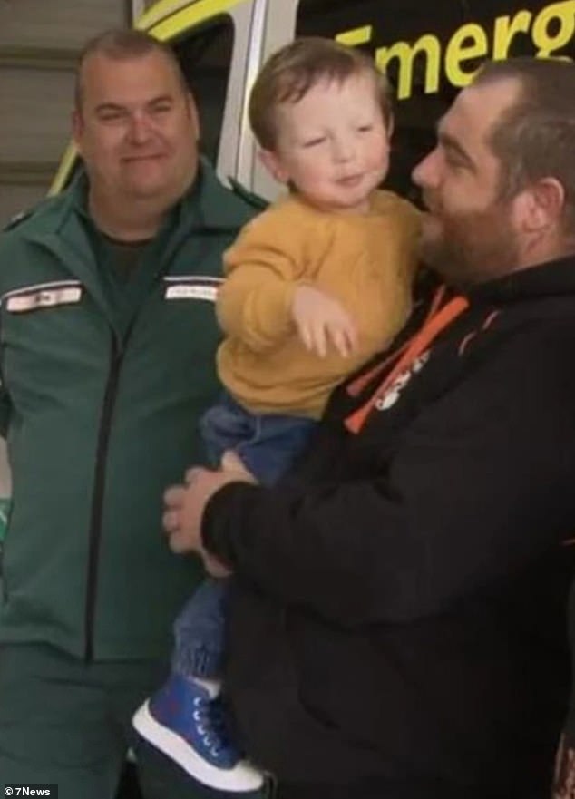 Robert Davis (pictured left) received an alert via the GoodSAM app on his phone that the young boy (pictured center) needed medical attention, while the off-duty paramedic stood in line waiting for an ice cream cone