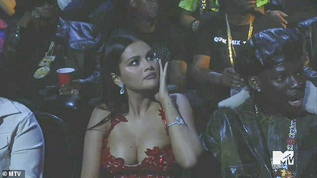 Distraught: When she was taken off stage, Selena Gomez actually looked quite distraught as the stage went dark and briefly transitioned to her hit Good For U before starting to perform another new hit, Get Him Back, flanked by a number of pink-clad singer-dancers