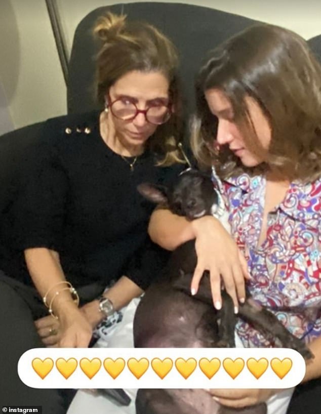 Paula Rodríguez (right) and her mother share a special moment with Maia at their home in Santo Domingo, Dominican Republic