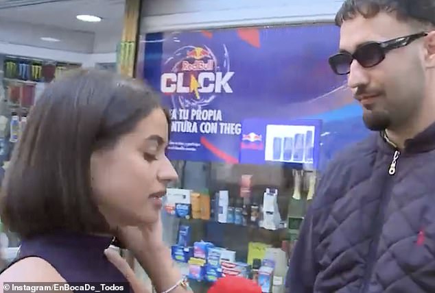 Isa Balado was delivering a report at a local supermarket when the man (right) approached her from behind and grabbed her from behind, footage showed