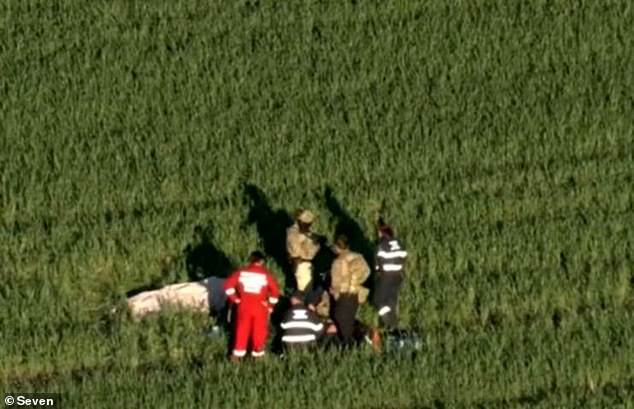 The officer followed Bowles to a wheat pasture (above) where he shot himself during police negotiations