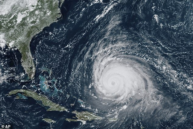 This satellite image from the National Oceanographic and Atmospheric Administration via NASA shows the hurricane moving north