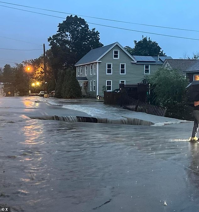 A massive sinkhole opened up in the central Massachusetts city, which one woman says she and her vehicle almost fell into due to the heavy current