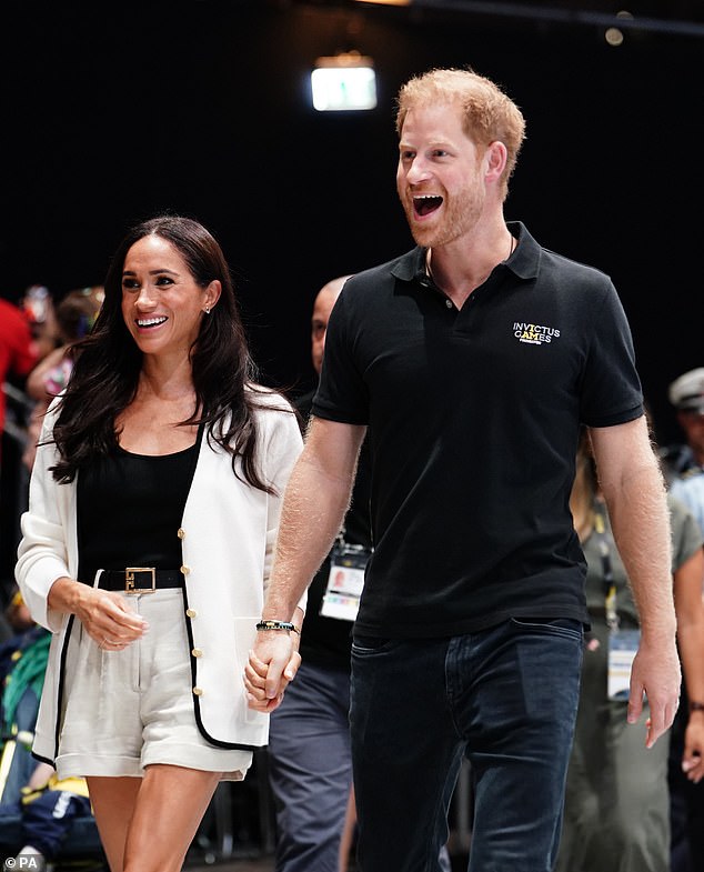 The Duchess of Sussex, 42, stunned in linen shorts and a black tank top which she paired with a Chanel jacket, Givenchy belt and £910 Chanel shoes