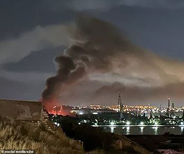 In blistering attacks, seven massive explosions hit a naval port in Sevastopol, setting the shipyard on fire and wounding at least 24 people, Russian officials said.