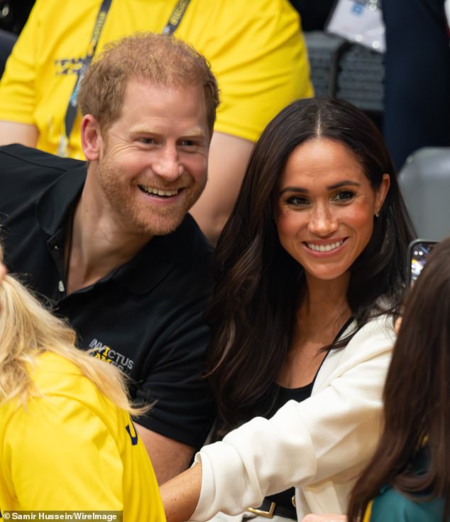 Harry, who happily posed for dozens of selfies with fans, took a back seat this morning as most people in the crowd wanted to take a photo with Meghan.