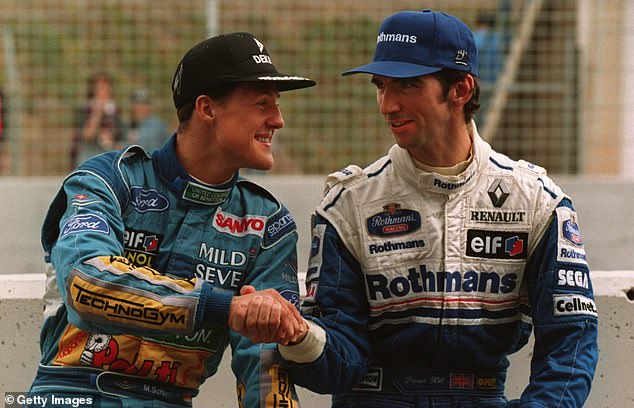 The German headed Damon Hill (right) to the championship by one point