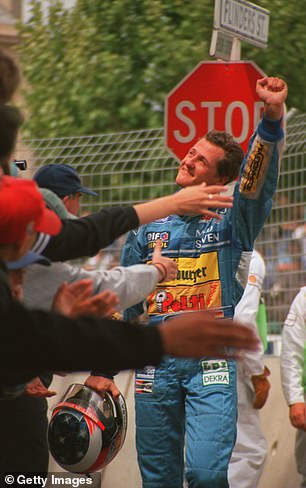 After Hill no longer appears, he salutes the crowd to mark his first championship win