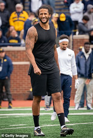 Colin Kaepernick participates in a throwing exhibition during halftime of the Michigan spring football game at Michigan Stadium on April 2, 2022