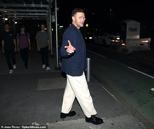 Not this time: Justin Timberlake flashes a peace sign after *NSYNC's reunion at the VMAs - enjoying dinner at Ambra restaurant in Manhattan's West Village