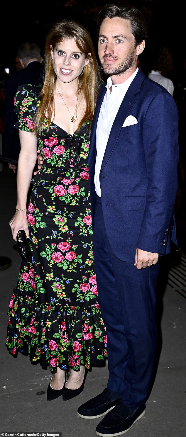 The couple posed for cameras before entering the first British exhibition dedicated to the French couturier's work