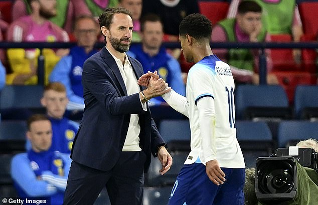 Southgate (left) praised his midfielder after the match, claiming Bellingham 'definitely has leadership qualities'