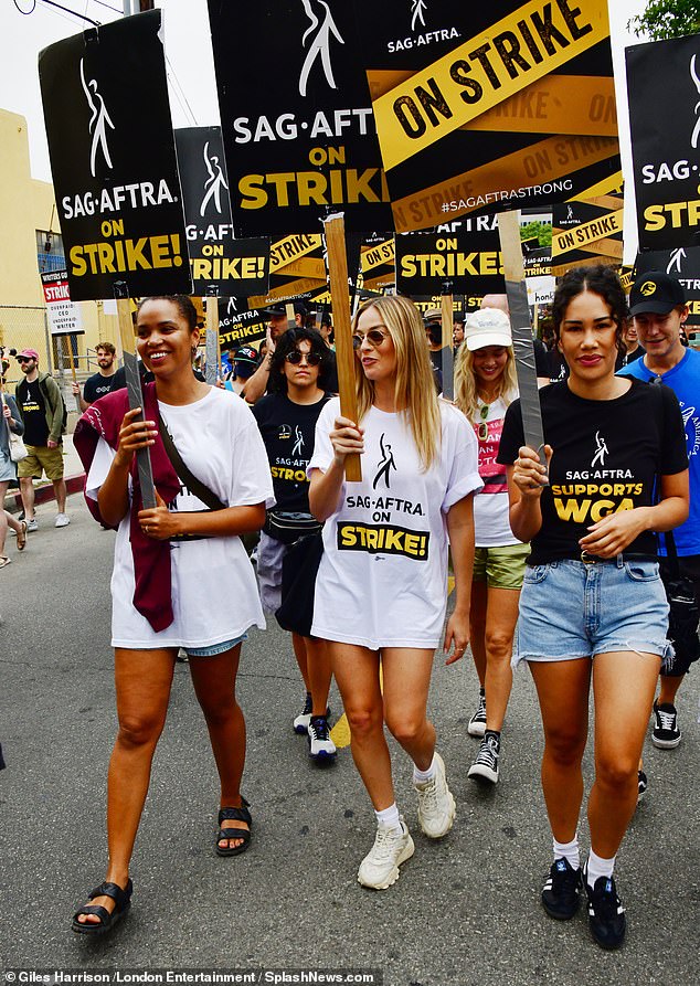 Fighting for their rights: Hollywood actors and writers are currently united in their first 'double strike' in more than 60 years, vowing to protect every worker in the industry from being replaced by AI