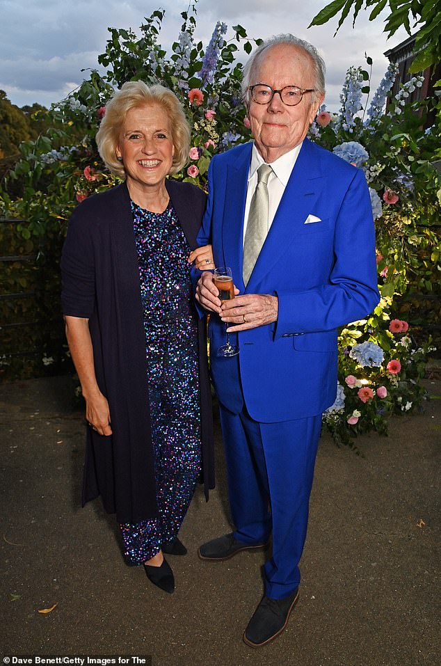 Party: Hilary and Michael Whitehall enjoyed a glass of champagne