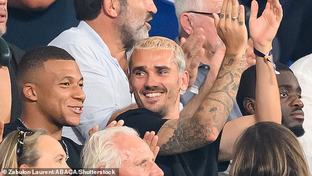Football stars Kylian Mbappé and Antoine Griezmann cheer on France in the stands