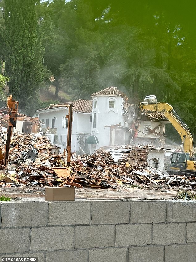 Crews were seen taking apart the house using bulldozers and excavators, as seen on TMZ