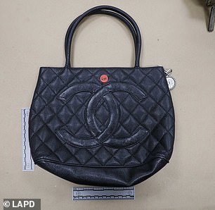 Hundreds of designer bags were discovered by officers after the raid on the Ackmans building