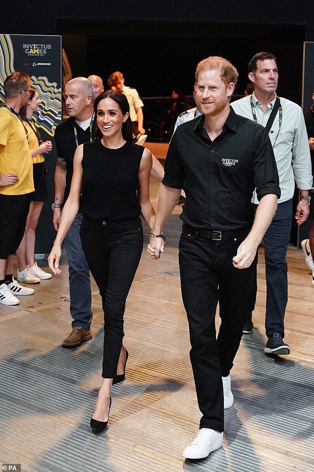 Meghan added height to her slim frame on Wednesday with a pair of black pointed-toe stilettos