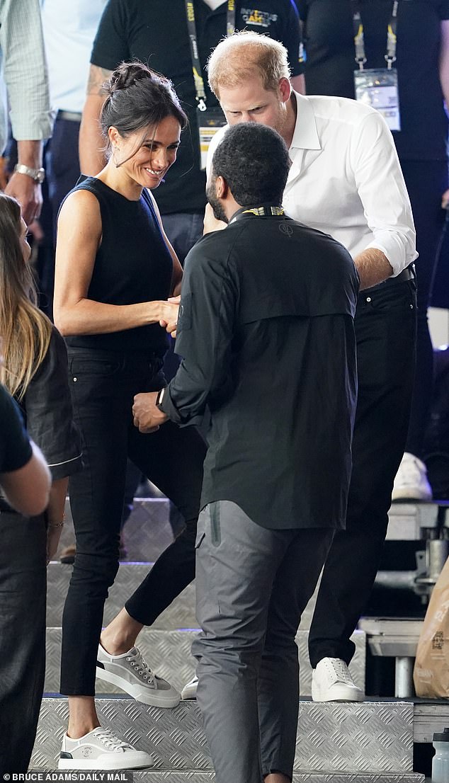 Meghan and Harry at the Invictus Games on Wednesday.  Most people in the crowd wanted to have their picture taken with the Duchess