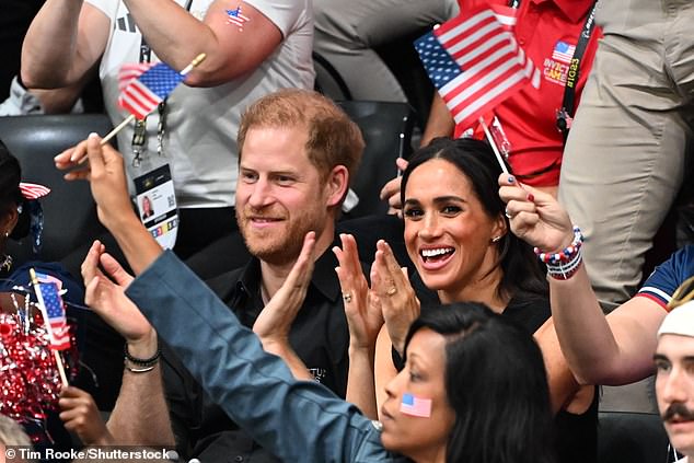 The Duke and Duchess of Sussex cheer on the US team as they watched basketball at the Invictus Games yesterday