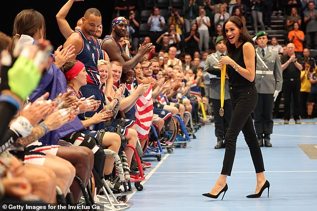 The Duchess of Sussex hands out medals to the winning US wheelchair basketball team