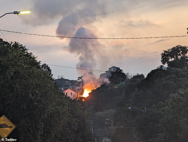 A local woman claimed on social media that the 'massive house fire' started in an abandoned detached house