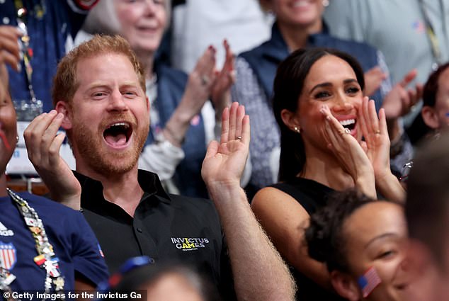 Meghan was as excited as ever at the games with Prince Harry