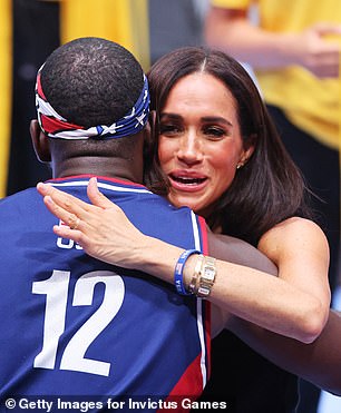 The Duchess hugs one of the stars of the tournament