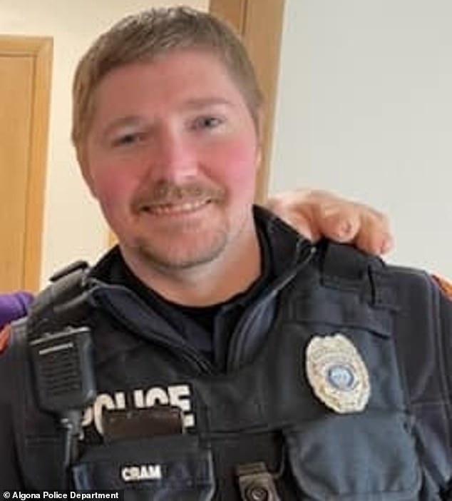 The condition of the officer – named Kevin Kram (photo) by local media – is unknown