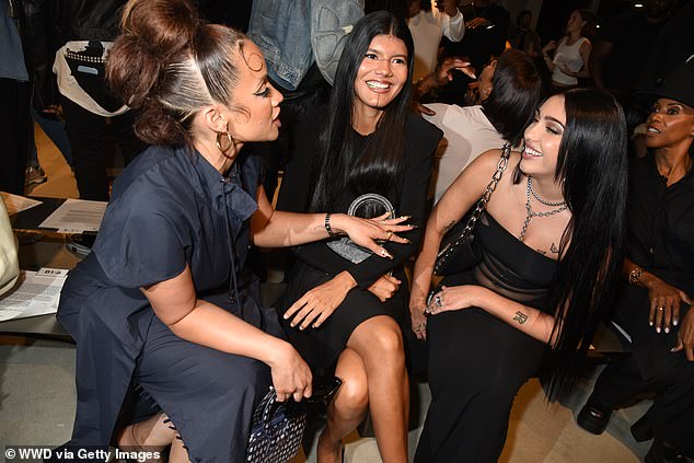 Friends: The daughter of Madonna and Carlos Leon, right, slipped into a long figure-hugging dress with mesh detailing around her torso (pictured with Dascha, left, Zaya Guarani, center)