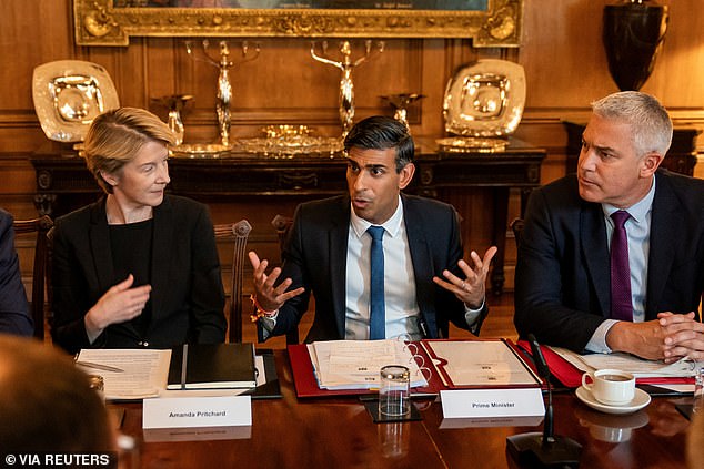 The announcement followed a roundtable yesterday with the Prime Minister, Mr Barclay, clinical leaders and NHS chiefs to discuss the NHS's preparation for the colder months.  Pictured: Prime Minister Rishi Sunak, Health Secretary Steve Barclay and NHS England boss Amanda Pritchard at a roundtable meeting at 10 Downing Street on September 13