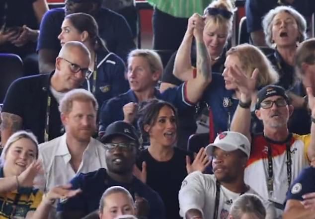 Meghan showed off her showbiz roots by singing along with the audience