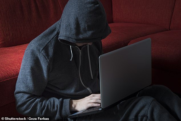 Russian cybercriminals known as AlphV or BlackCat claimed to have posted more than 1 terabyte of stolen data to the dark web during the attack.  Pictured: stock photo of a hacker