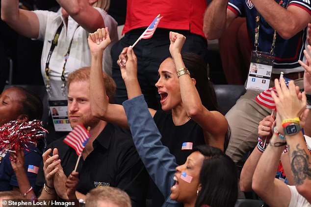 Meghan Markle wears a stars and stripes badge and cheers for Team USA on day four of Prince Harry's Invictus Games