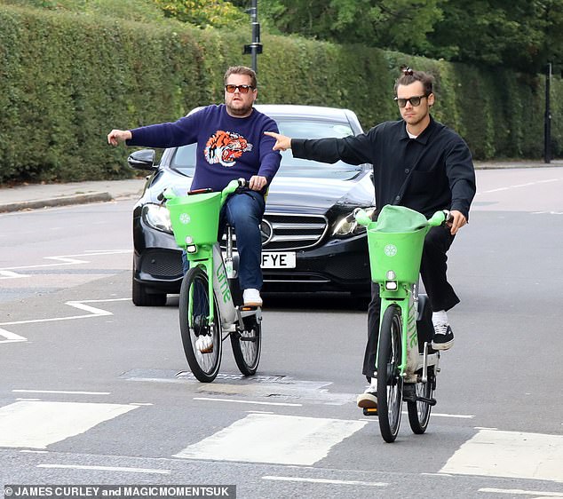 He's done this before: While cycling through leafy Primrose Hill, Styles suggested he knew his way around the cycling skills test by signaling to the passing driver