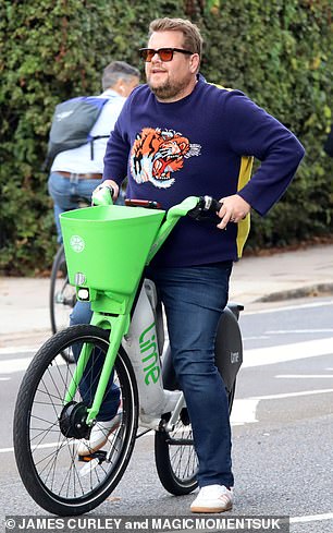 There he is: Corden was easy to spot in a boldly patterned Gucci sweater during his outing with Styles on Wednesday
