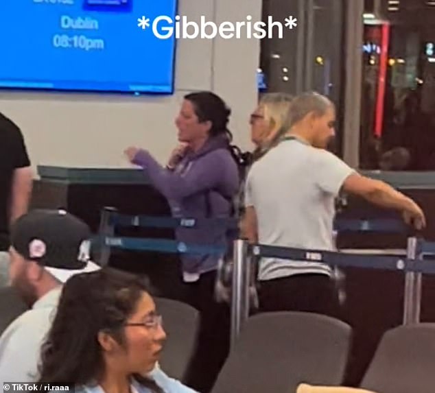 The video shows a nurse protesting at Aer Lingus as she demands to be allowed on the plane