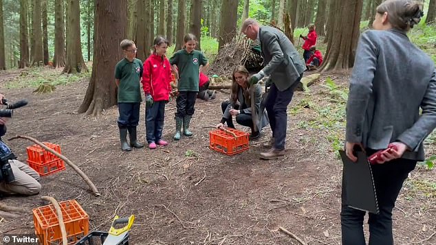 The royal couple received books as a gift from the school for their children, George, Charlotte and Louis, and also helped the students prepare for a campfire