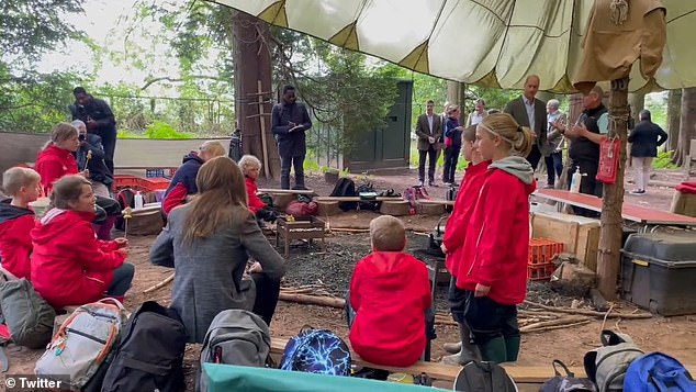 William and Kate helped children prepare food around a campfire today as they visited a primary school during their latest royal tour