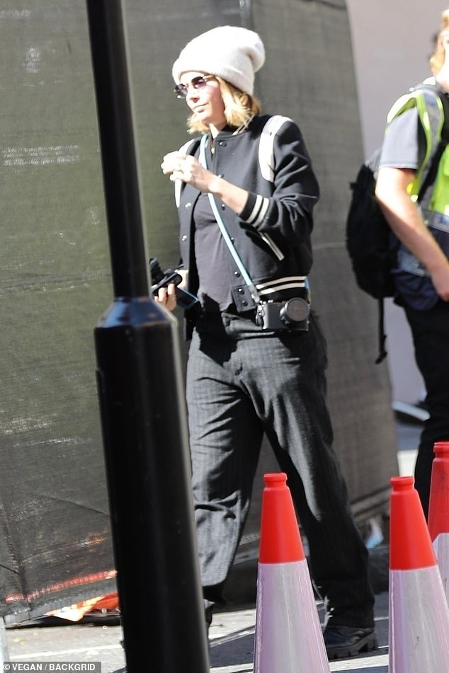 Low-key: Opting for a varsity jacket and relaxed pinstripe trousers, Cara looked relaxed ahead of what is expected to be a more glamorous red carpet appearance on Thursday night